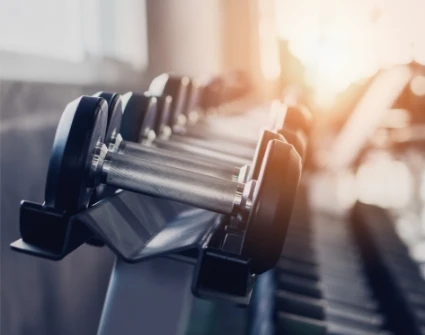 weights lined up with the light in the background